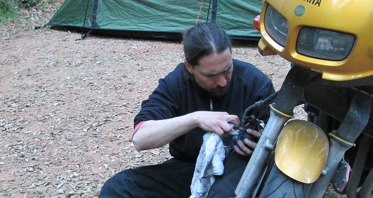 A younger Ren working on the brakes of a Fazer 600