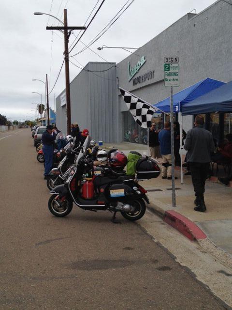 The Motorsport shop with the Scooter Cannonballers lined up outside