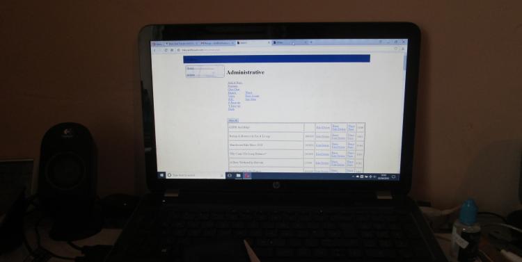 A laptop computer on Ren's desk