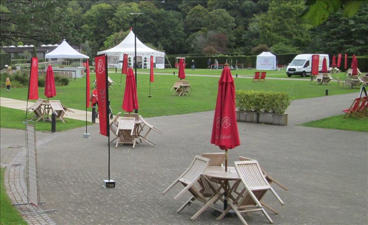 Table and chair with banners declaring The Antiques Roadshow