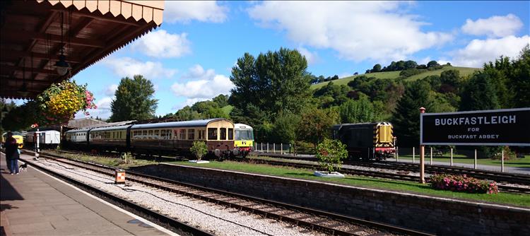 The old train station complete with carriages and hanging flower baskets