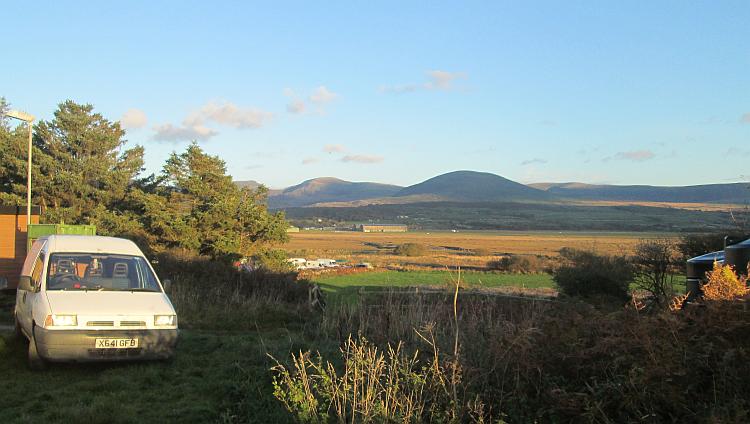 In the far distance we can see the Welsh mountains across an open marshy plain