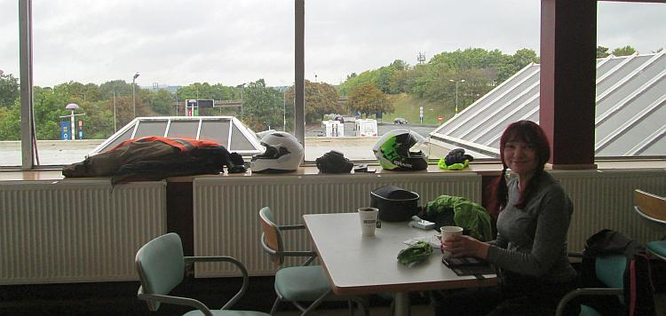 Sharon sits at an ordinary table at Frankley Services