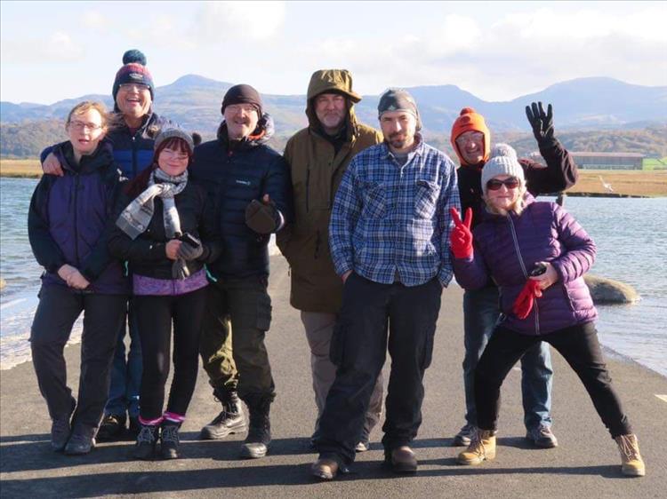 Sharon is surrounded by friends all smiling in the cold sun in Wales