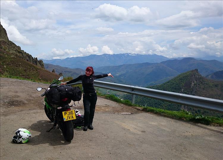 Sharon throws her arms open in joy at the amazing scenery of The Picos in Spain