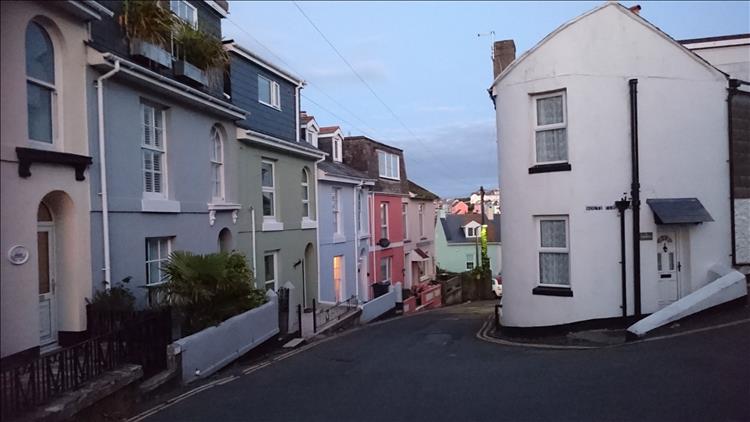 This house is on an acute corner and curved into the wedge of the road