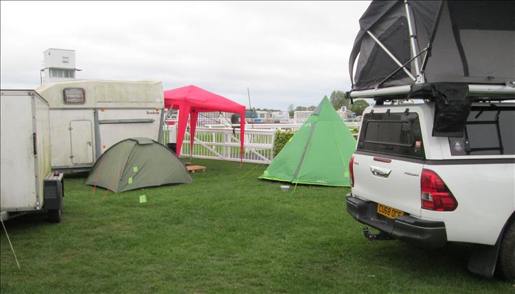 Ren's green teepee tent is still standing among trucks, trailers and cars