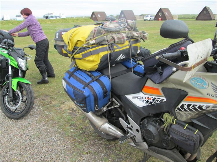 Ren's 500 is buried under it's load as Sharon straps her bags to the 250