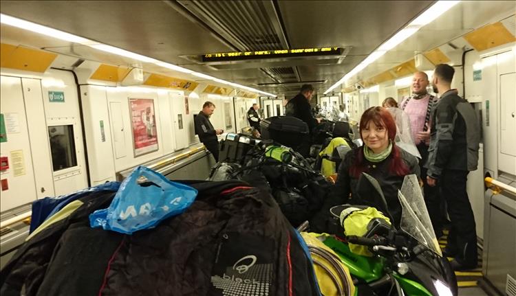 Sharon in the channel tunnel train with her motorcycle and several others as well