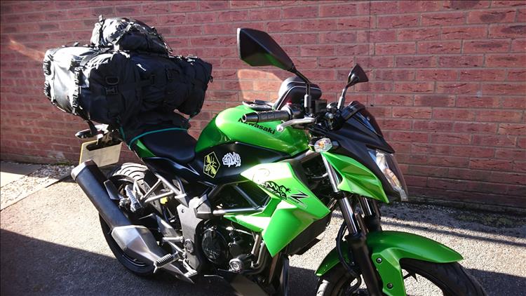 3 large and one small bag all strapped together and onto the back of the small 250. The luggage looks huge
