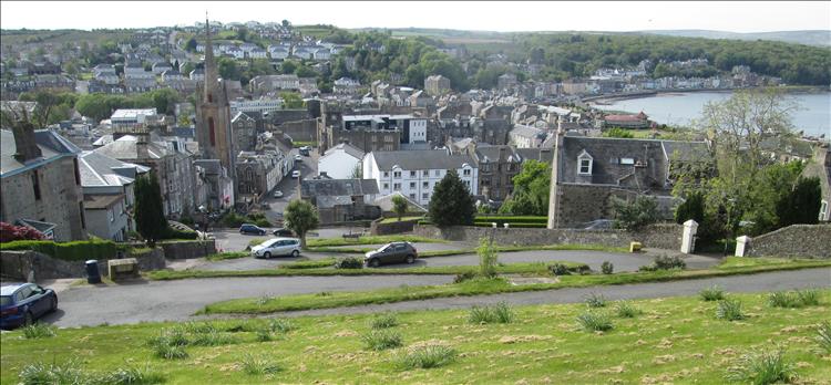 Looking down the hill we see the road wind even zig-zag it's way down to the town below
