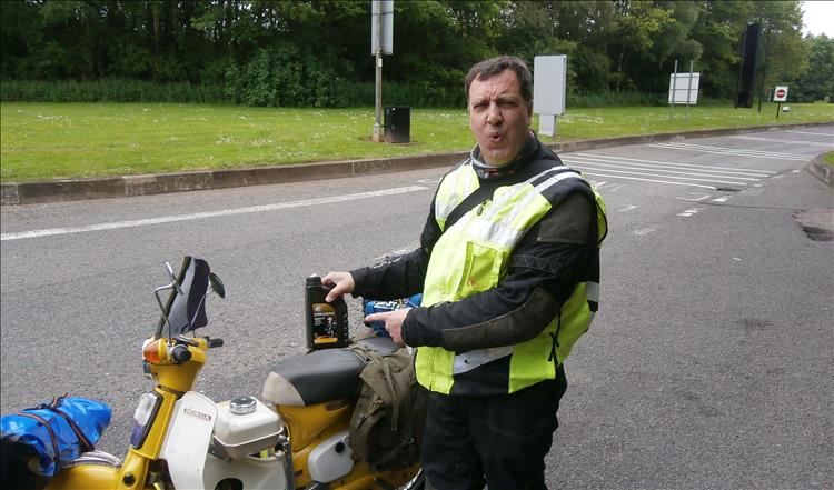 Bogger stand by the poorly Cub with a 1 litre oil bottle