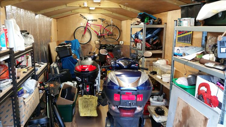 A shed filled with bikes, you have to guess which is which