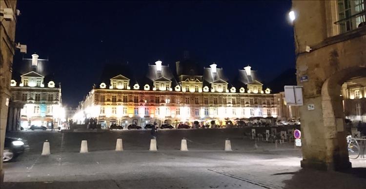 the building in the town square are beautiful and cleverly illuminated