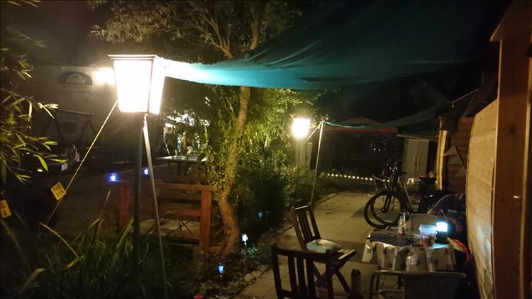 The pod, the veranda, the light all on a dark evening in Germany