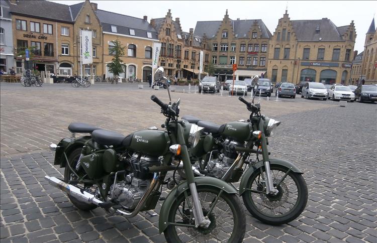 2 smart enfield bullets in the broad town sware with shops, cafes and bars around the edges