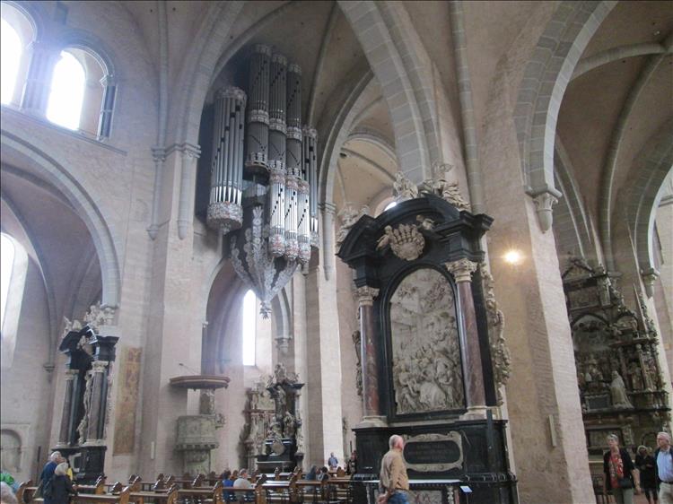 Massive pipe organ as well as sculptures, carvings and ornate masonry inside the large church