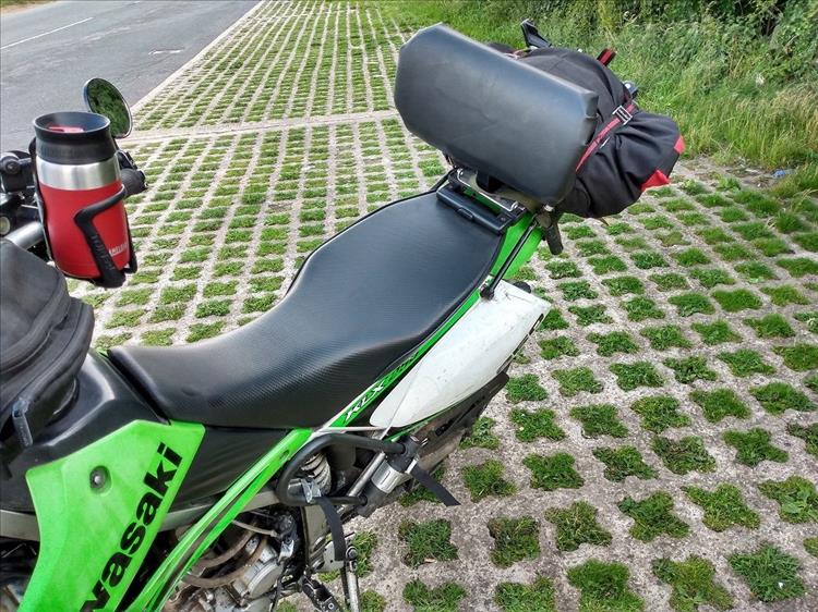 The KLX250 has a wider saddle and a padded backrest for long distance trips