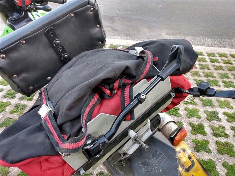 The backrest, the bags and the frame seen close from the rear of the motorcycle