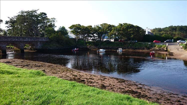 The stone arched bridge and the trees and the river banks of Chushenden