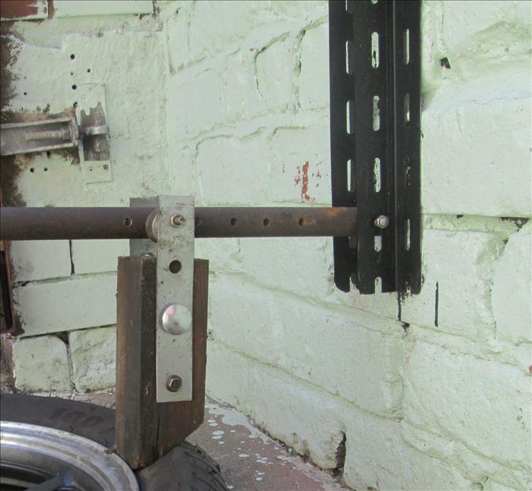 Close up of the bar, slotted angle iron, the wood and pivot points