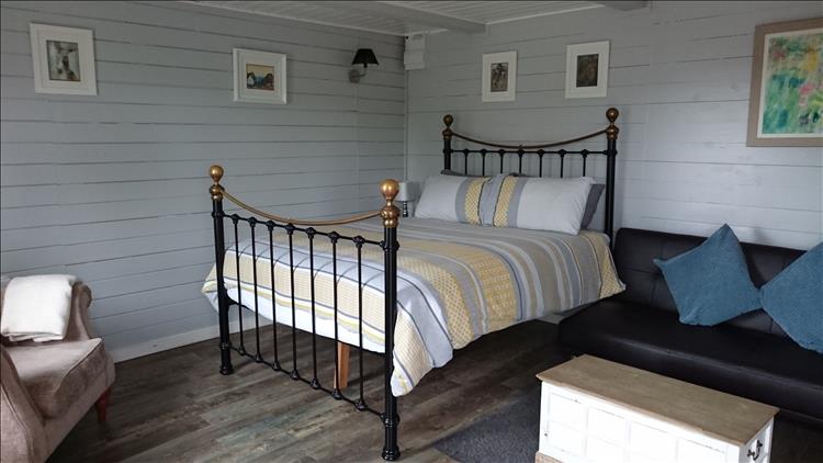 The bed is quite high in the comfortable and warm chalet