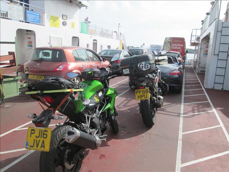 The bikes and cars on an open deck ferry making the short crossing to Strangford