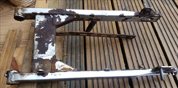 The top side of the swing arm is also rusty and lots of paint has flaked off