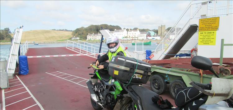 Sharon looks at the camera Ren is holding as the ferry leaves the port