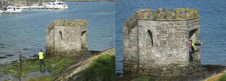 Sharon walking over the slippers rocks and then waving from within the tiny castle