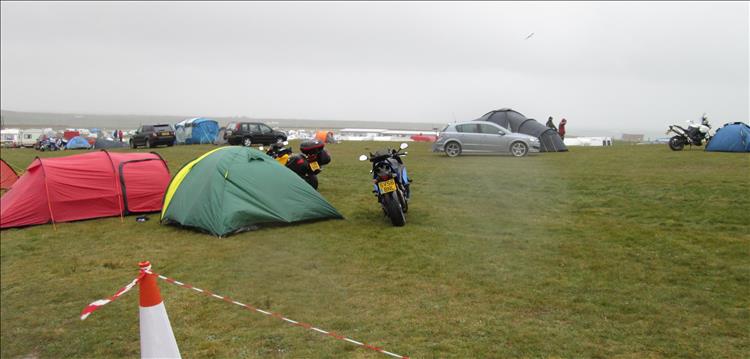 motorcycles and tents in the wind and the rain