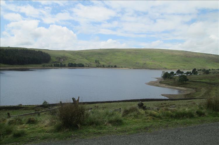 A reservoir set among the the green hills and  valleys south of Burnely