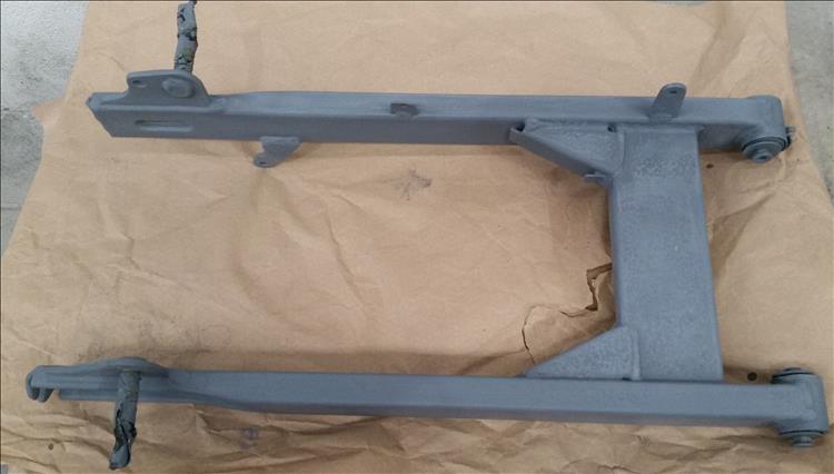 The high build paint colours the arm flat dull grey in preparation for the final finish