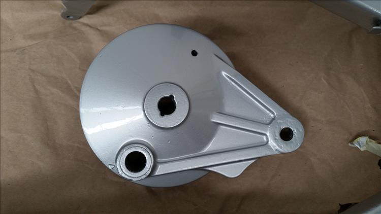 The rear brake plate looks smart with fresh flat grey silver paint