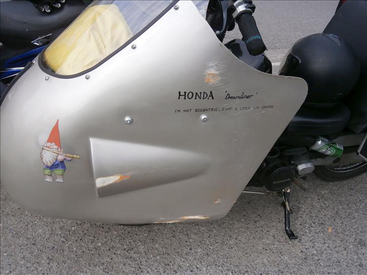 The huge ally streamliner fairing has several scores and scratches along one side