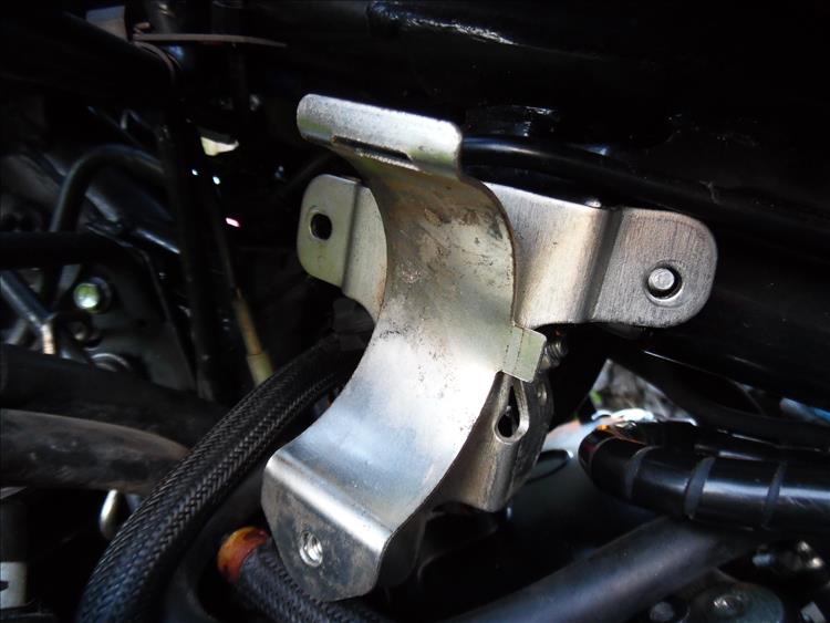 The half round bracket that holds the evap canister