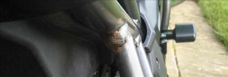 In the joint of the frame rust is just starting to show through the paintwork