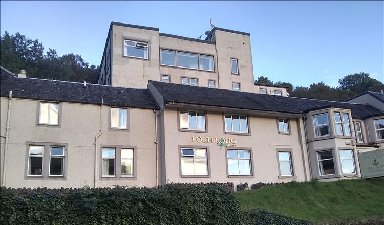 A just about acceptable but dull frontage is spoiled by the blocky outbuildings behind the hotel
