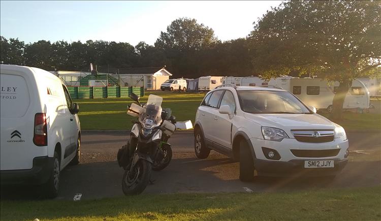 The bikes between various cars at the holiday park