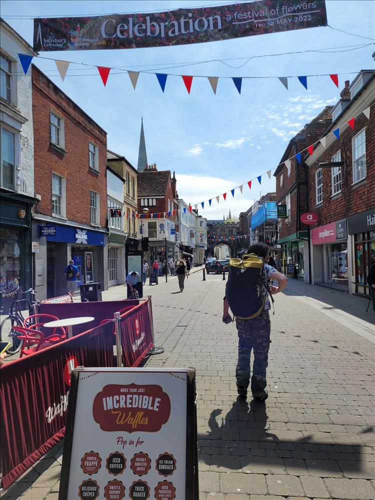 Along a regular town street Ren once again is laden with the big bag