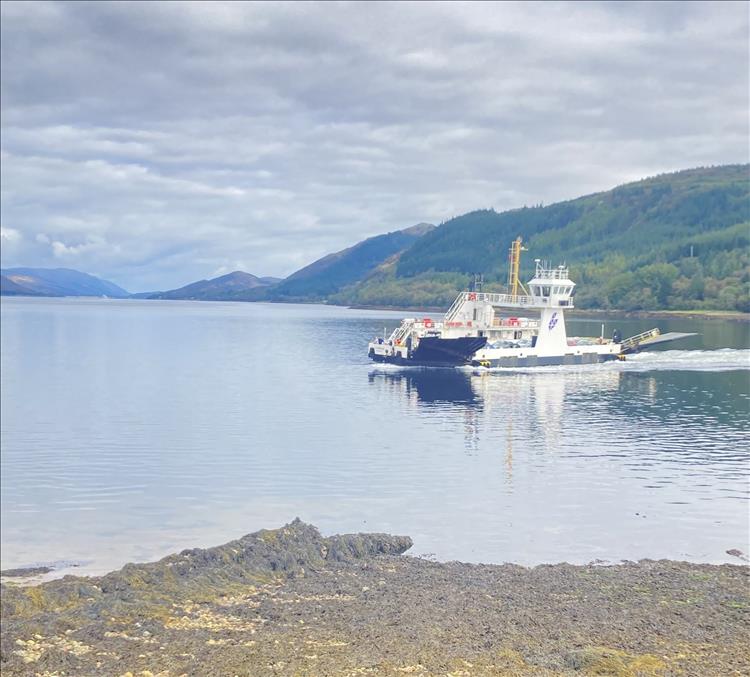 The small Corran Ferry on very calm waters of Loch Linnhe