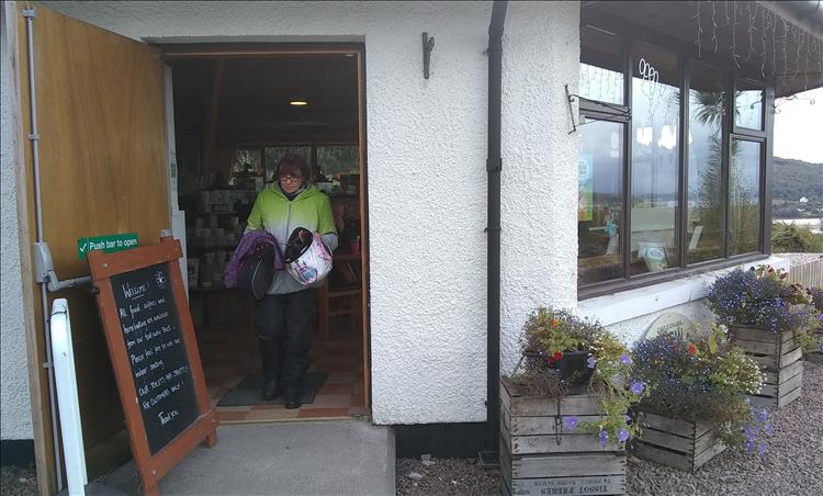 Sharon walking through the door of the once excellent cafe, looking a little downbeat