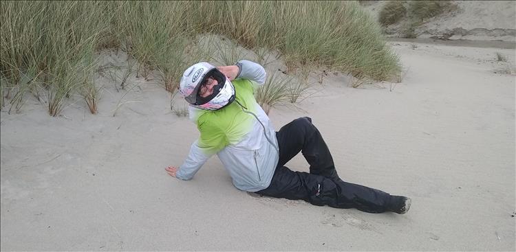 Sharon poses sexily on the sane at Sanna - wearing all her bike gear including her helmet
