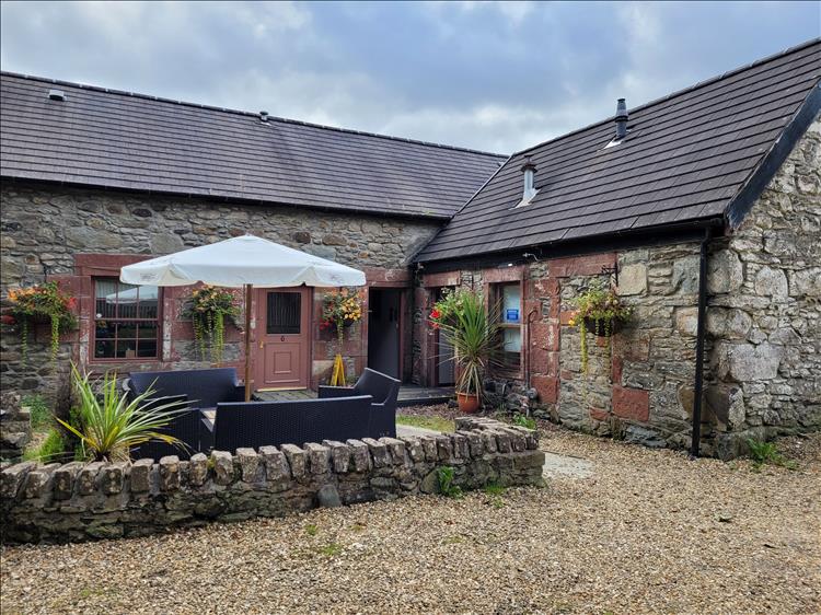 Behind the large Inn there's some smart outbuildings in which the room is located