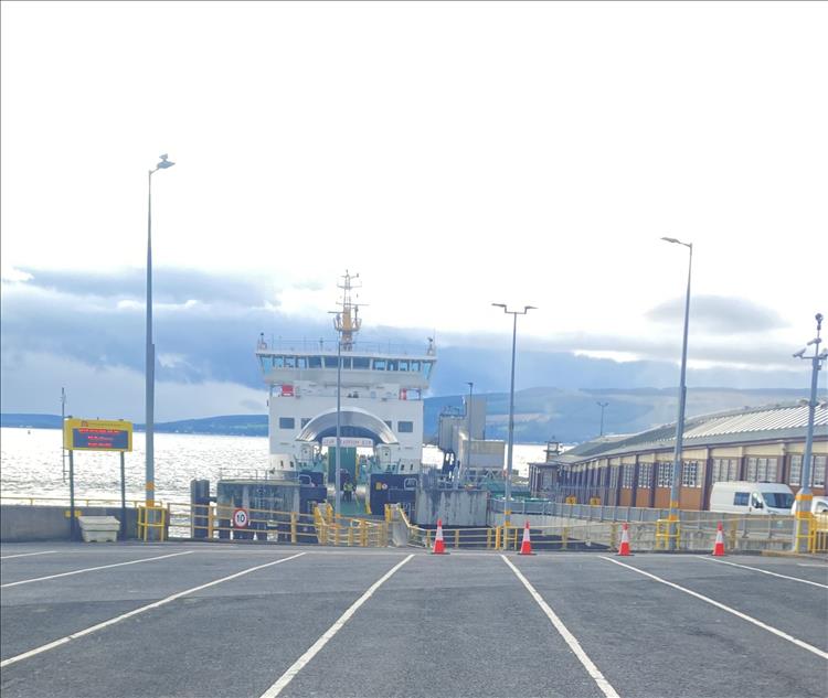 The ferry's bow is open for loading and we see the bay at Wemyss