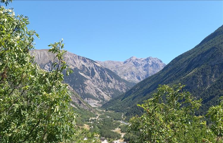 Steep valley sides, a small valley floor and remote location in The Alps