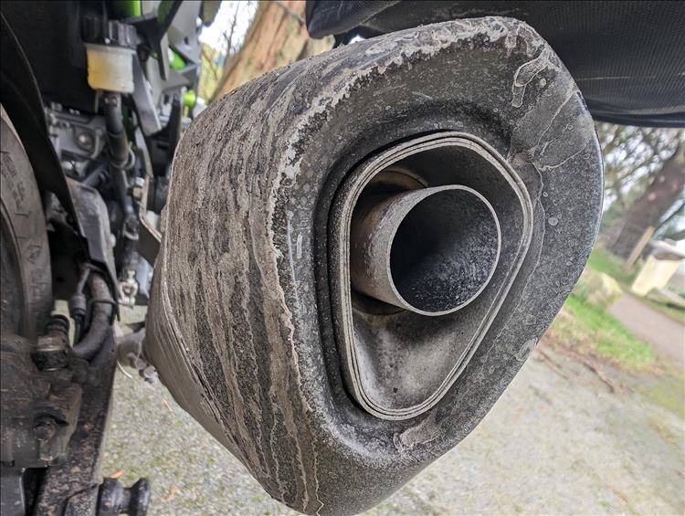 Salt and road dirt cakes over the exhaust of Sharon's new Z400