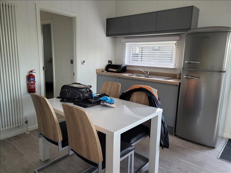The smart clean modern kitchen with table and chairs of the lodge
