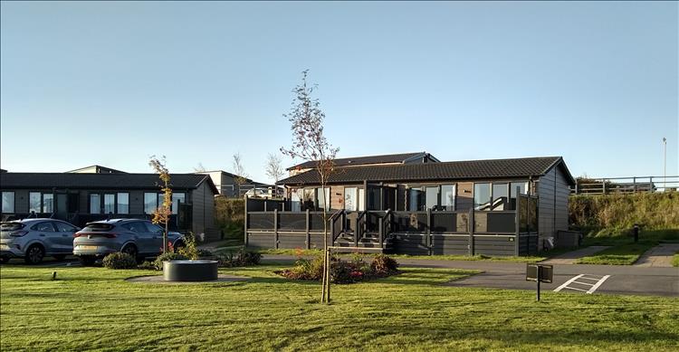 The grey plastic lodges are smart and new and well presented