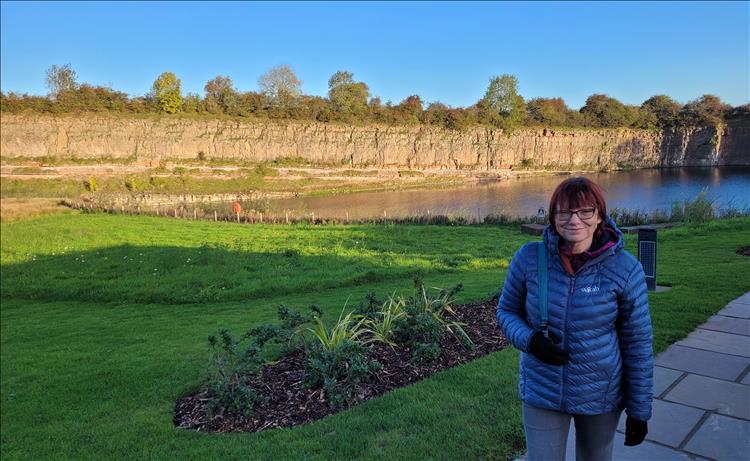 The remains of a quarry, the lower area filled with water, now landscaped and looking good